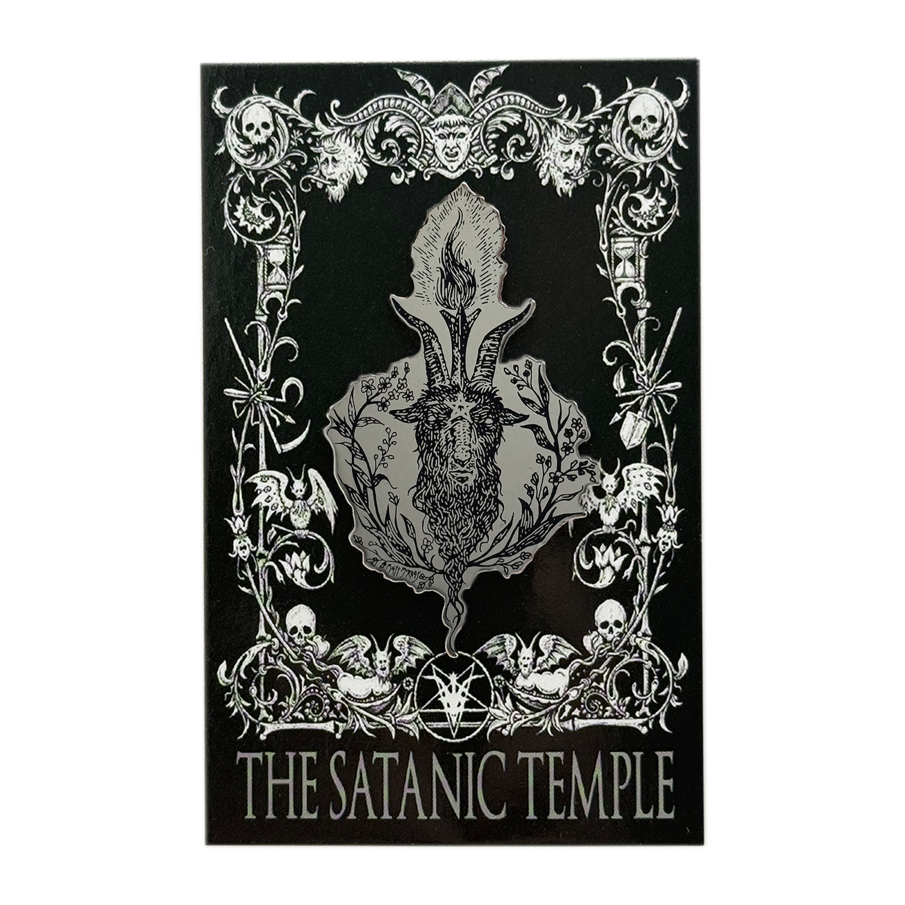 A black rectangular art print or poster featuring a silver-toned gothic illustration with skulls, ornate flourishes, a central horned figure motif, and the text 'THE SATANIC TEMPLE' at the bottom, shown on a plain white background.