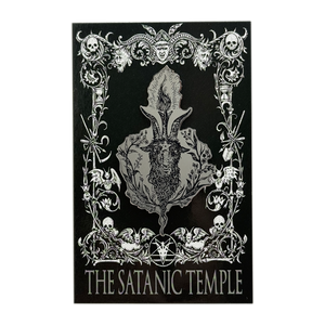 A black rectangular art print or poster featuring a silver-toned gothic illustration with skulls, ornate flourishes, a central horned figure motif, and the text 'THE SATANIC TEMPLE' at the bottom, shown on a plain white background.