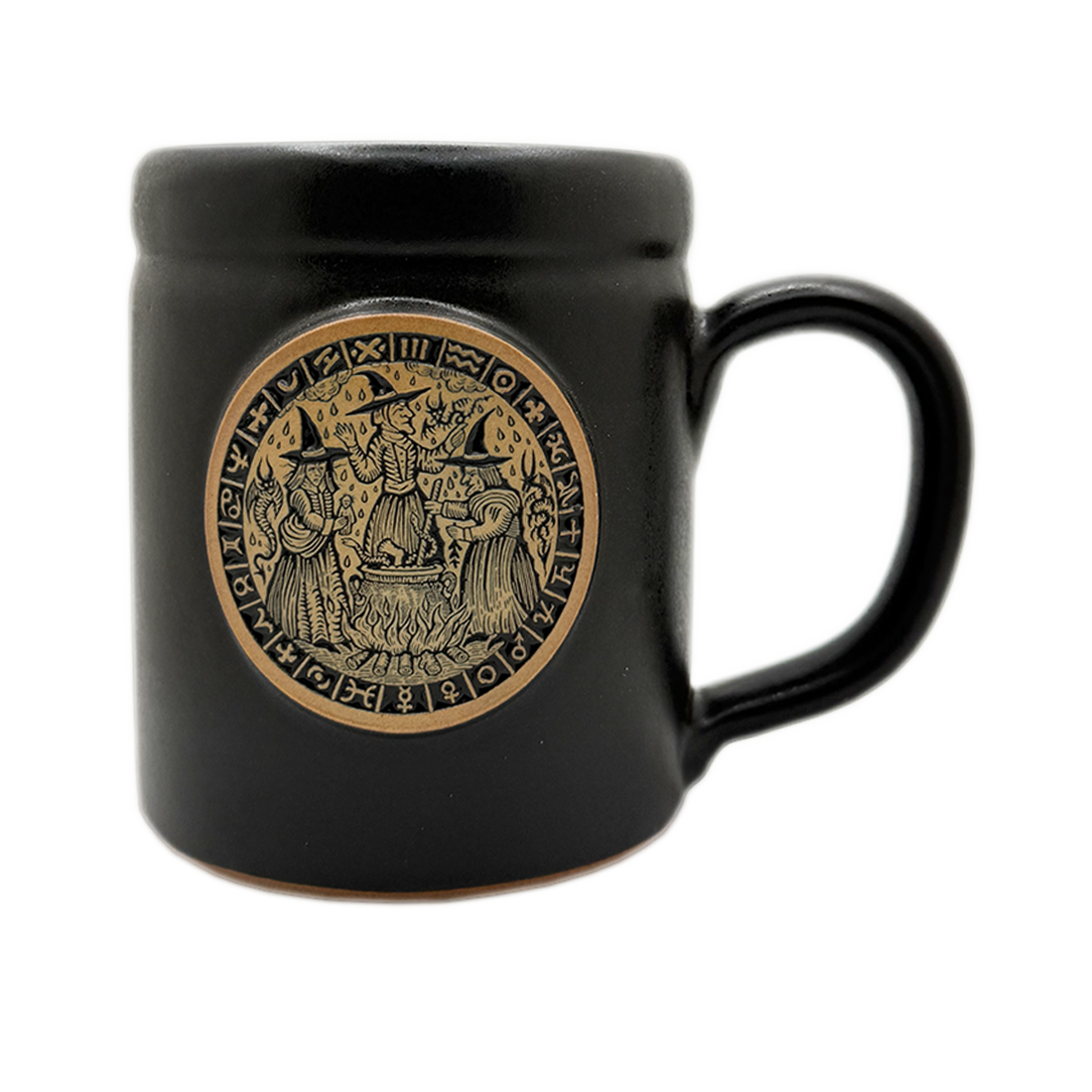 A glossy black ceramic mug featuring a circular gold-toned Norse-style emblem on the front with 3 witches, set against a plain white background.
